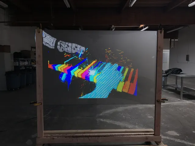 A transparent screen in the warehouse, daylight pouring in, image holding.