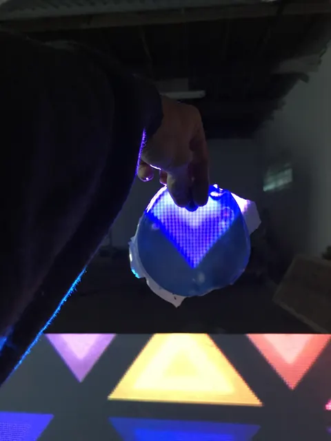 A pyramid lit from inside.
