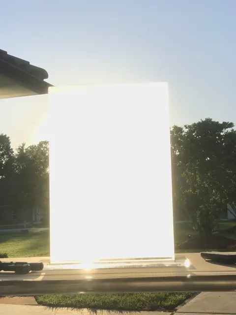 A coated sheet on a stand at sunset.