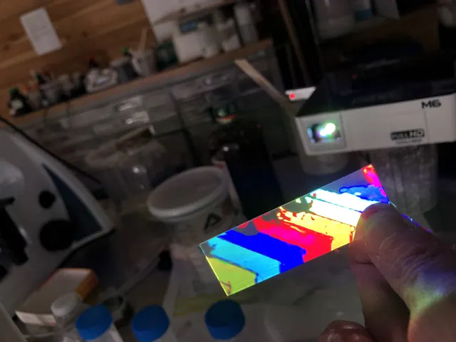 Handheld coated samples with colour bars.