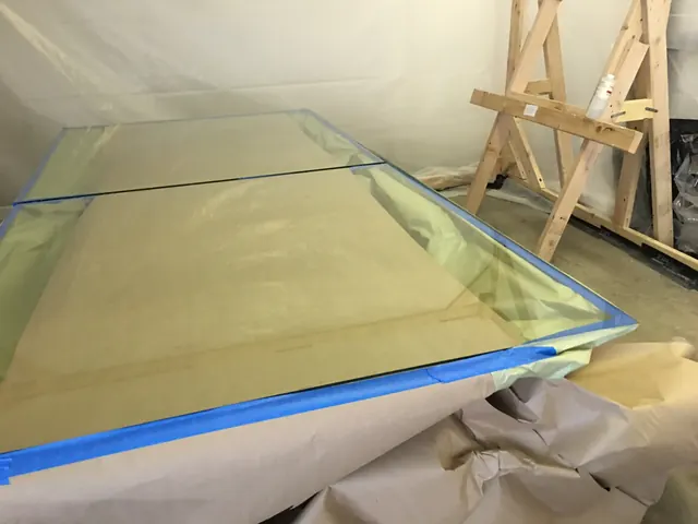 A coated pane curing on the table.