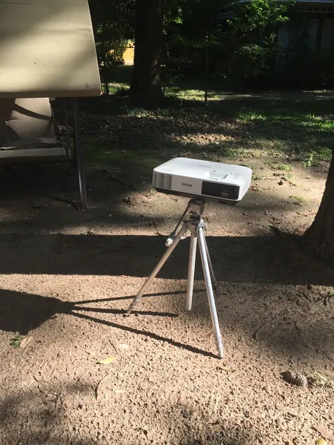 The first outdoor test rig: a tripod, a projector, a borrowed afternoon.