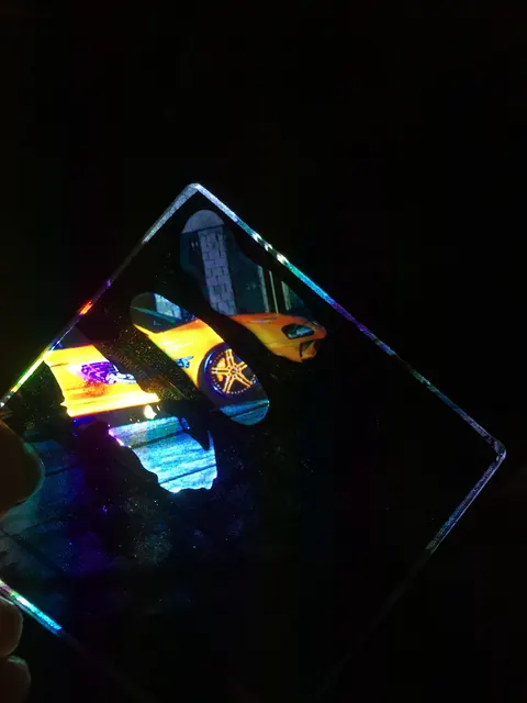 Iridescence across a sample — the coating doing something that had not been asked of it.